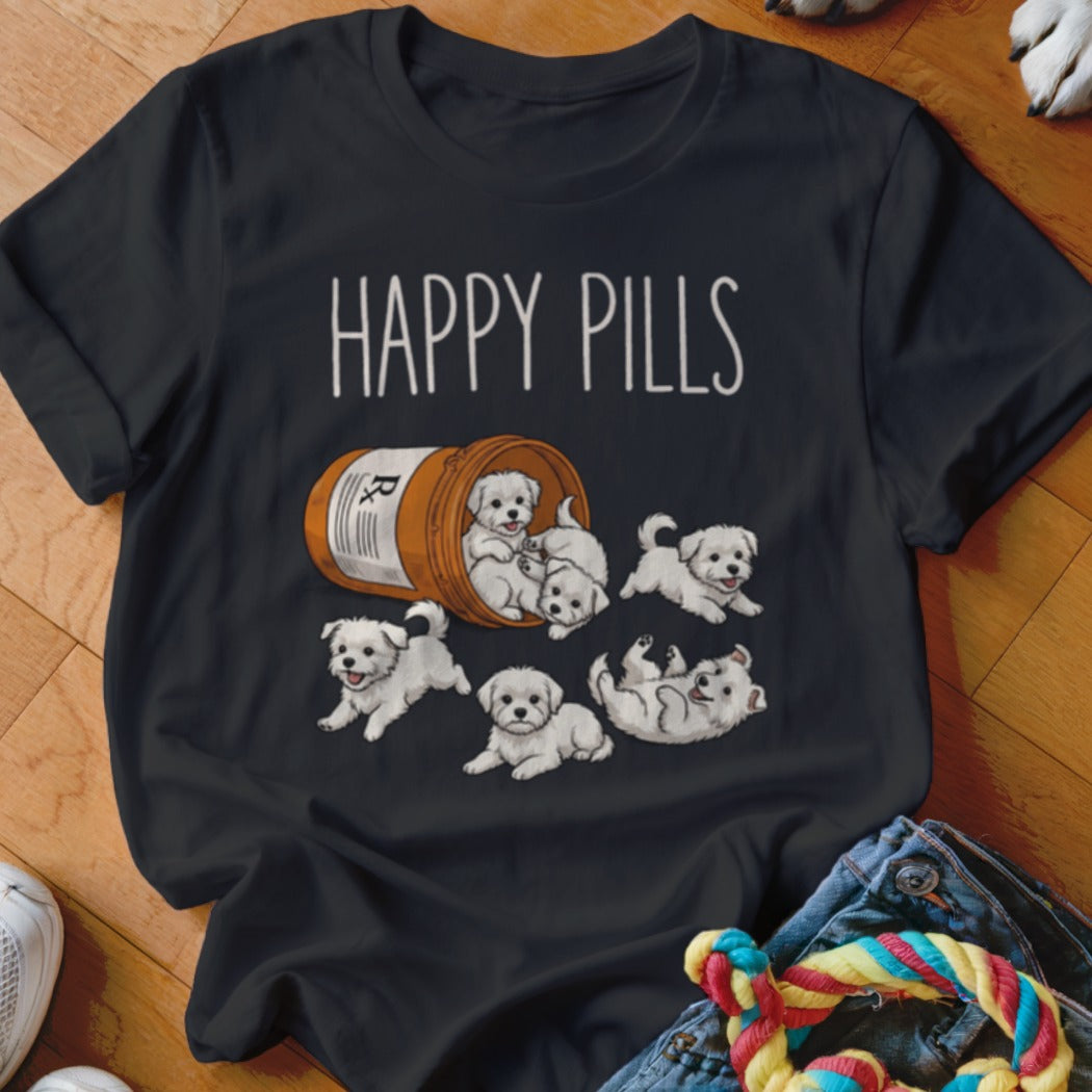 Black t-shirt with "HAPPY PILLS" text and seven playful white puppies spilling from a pill bottle.