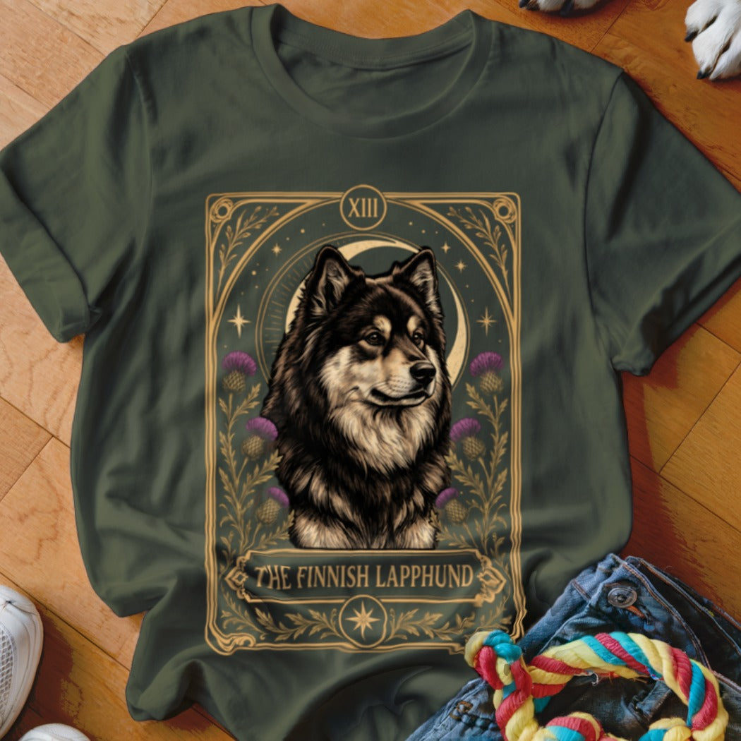Dark green t-shirt featuring a tarot-style graphic of a Finnish Lapphund surrounded by thistles.