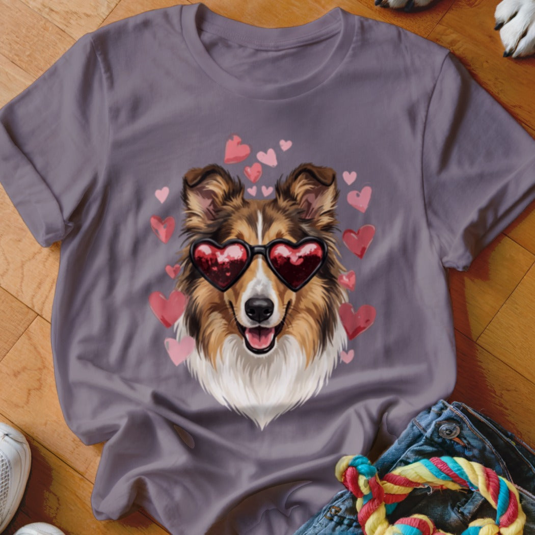 A mauve t-shirt features a graphic of a collie wearing heart-shaped sunglasses, surrounded by pink hearts.