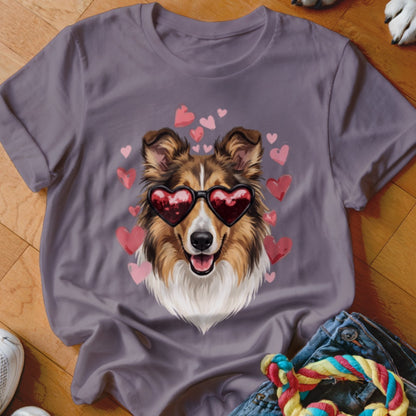 A mauve t-shirt features a graphic of a collie wearing heart-shaped sunglasses, surrounded by pink hearts.