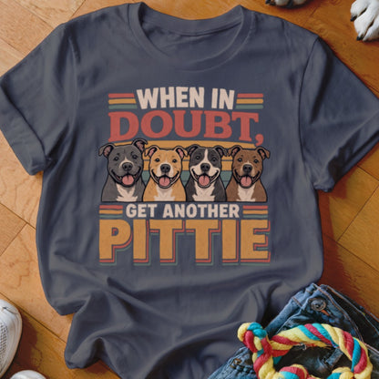 Dark t-shirt with four smiling pitbulls and text "When in doubt, get another pittie."