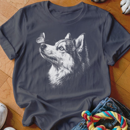 A dark grey crewneck t-shirt featuring a white sketch graphic of a husky dog looking at a butterfly.