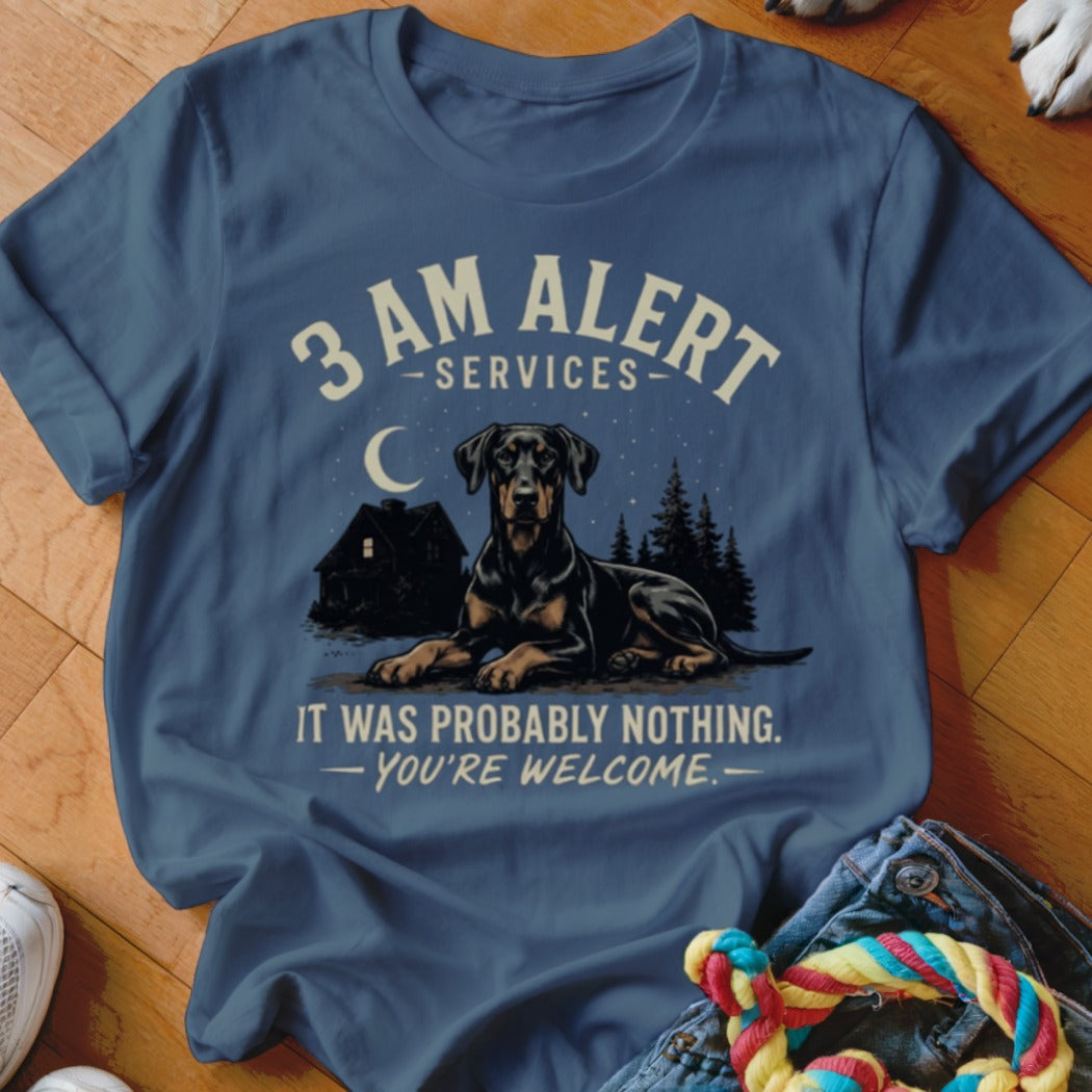 T-shirt graphic: Doberman dog lying down, house, trees, moon, and text "3 AM ALERT SERVICES" and "IT WAS PROBABLY NOTHING. YOU'RE WELCOME."