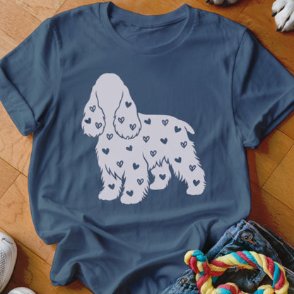Navy t-shirt with white dog silhouette covered in small dark hearts.