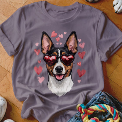 A grey short-sleeved t-shirt featuring a graphic of a dog wearing heart-shaped sunglasses surrounded by pink hearts.