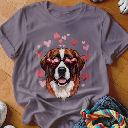 A gray crewneck t-shirt featuring a Saint Bernard wearing heart-shaped sunglasses surrounded by pink hearts.