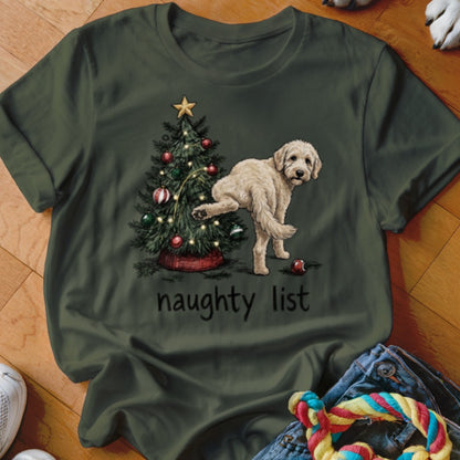 T-shirt with dog near Christmas tree, text "naughty list"