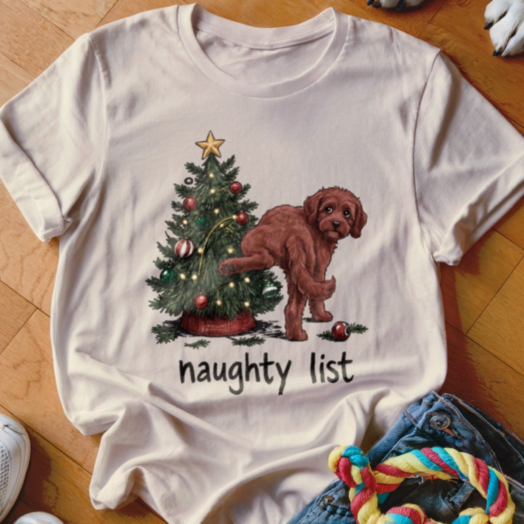 White t-shirt with a Christmas tree and a brown dog, "naughty list" text.