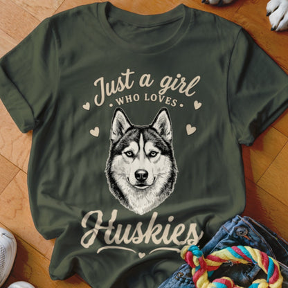 Dark green t-shirt featuring a husky graphic and the text Just a girl who loves Huskies.