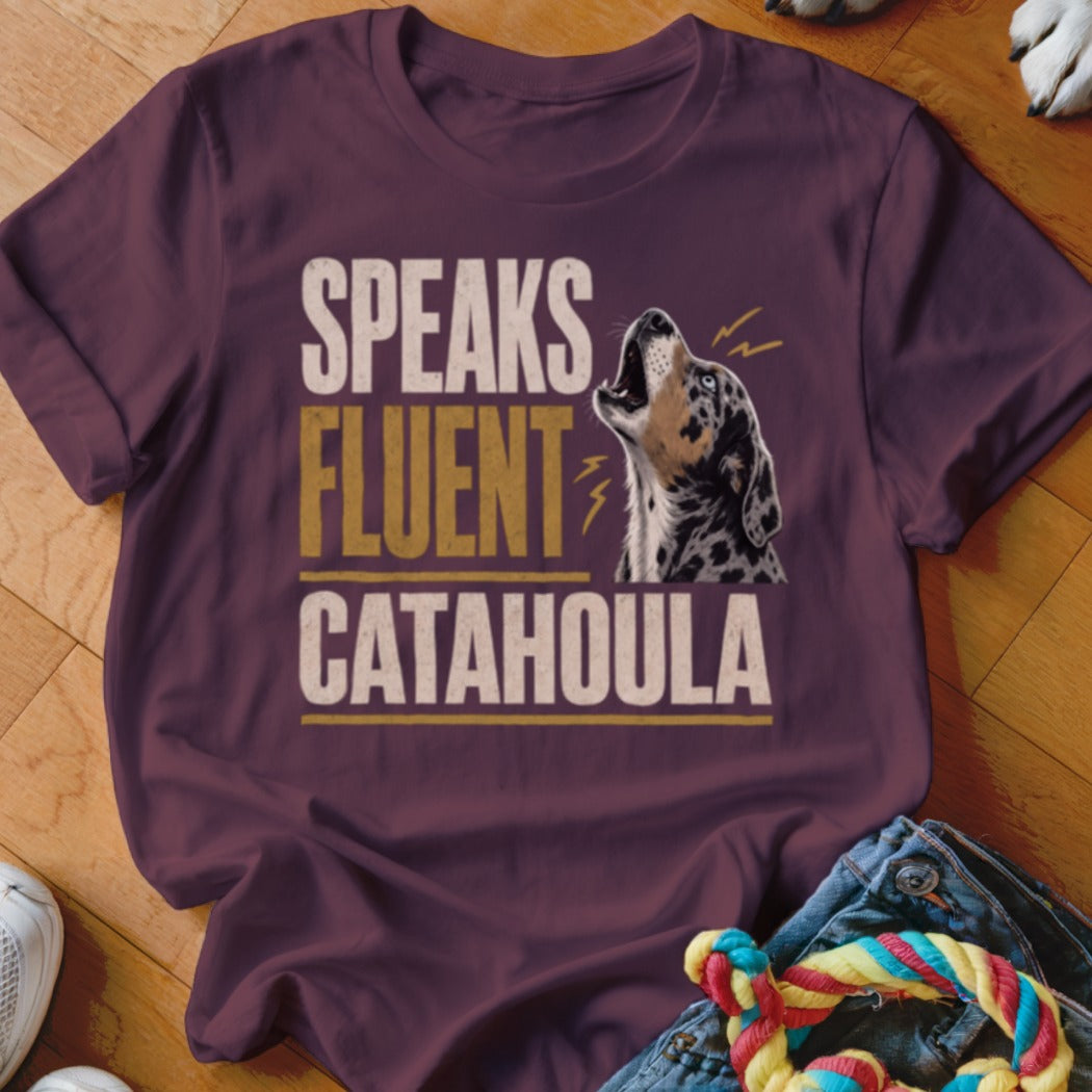 Maroon t-shirt with "SPEAKS FLUENT CATAHOULA" text and a howling Catahoula dog.