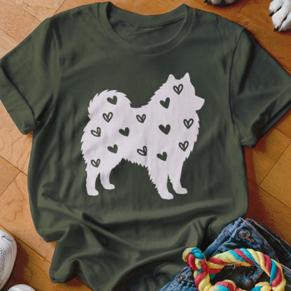 White dog silhouette with black hearts on a dark green t-shirt.
