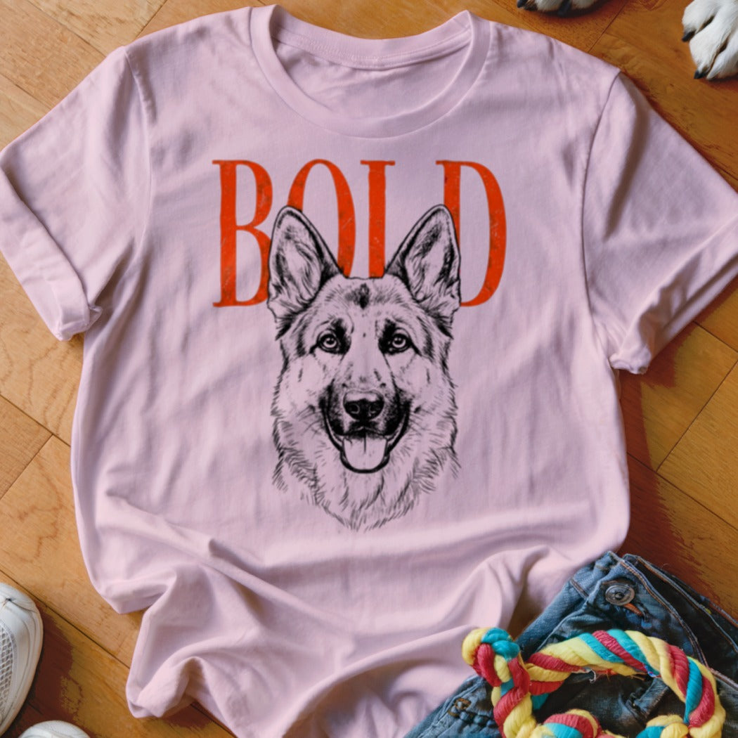 Light pink t-shirt with "BOLD" text above a sketch of a German Shepherd dog.