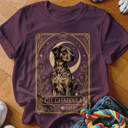 Maroon t-shirt featuring a tarot-style graphic of a Catahoula leopard dog with the text The Catahoula.