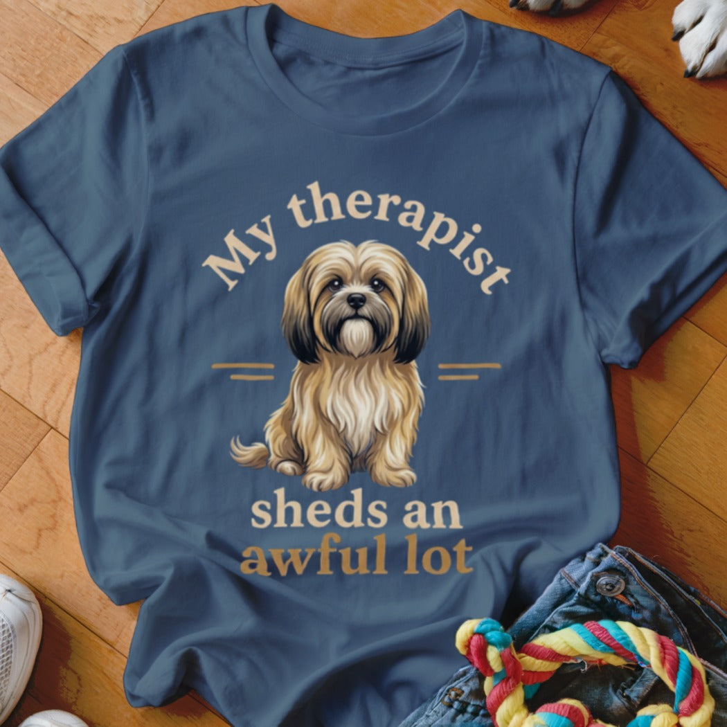 Blue t-shirt with dog illustration and text "My therapist sheds an awful lot".