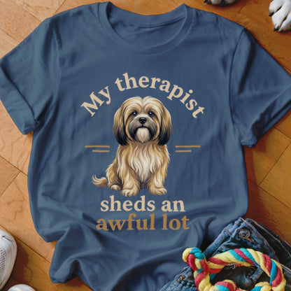 Blue t-shirt with dog illustration and text "My therapist sheds an awful lot".