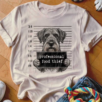 Schnauzer mugshot on t-shirt reads "professional food thief"