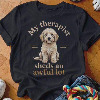 Black t-shirt with fluffy dog graphic and text "My therapist sheds an awful lot".
