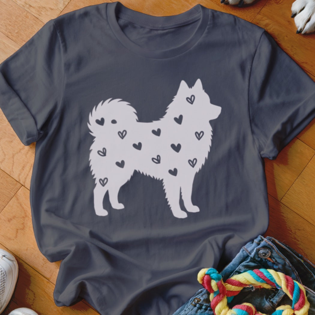 White dog silhouette with black hearts on a dark grey t-shirt.