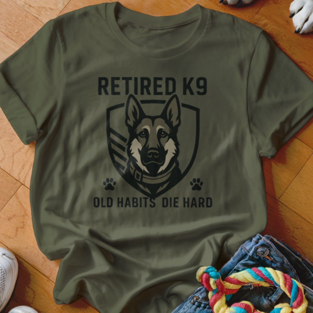 Olive green t-shirt with "RETIRED K9 OLD HABITS DIE HARD" text and German Shepherd.