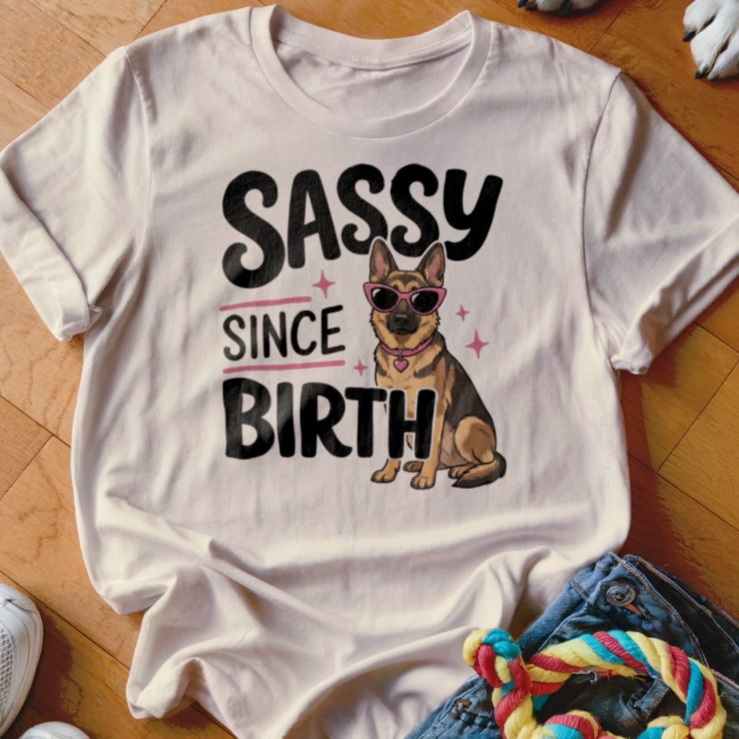White t-shirt with "SASSY SINCE BIRTH" text and a German Shepherd wearing sunglasses.