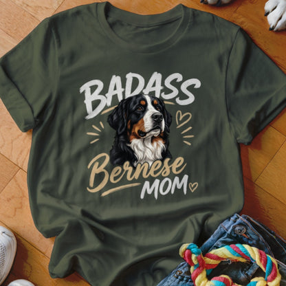 Dark green t-shirt featuring a graphic of a Bernese Mountain Dog with the text "BADASS Bernese MOM".