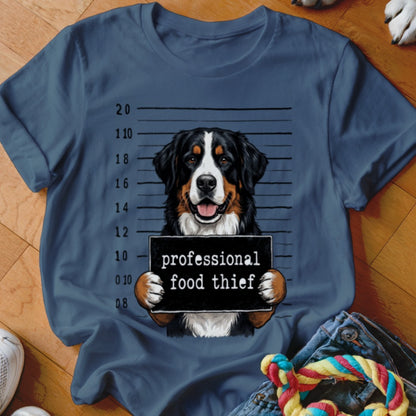 Bernese Mountain Dog mugshot with text "professional food thief" on a t-shirt.