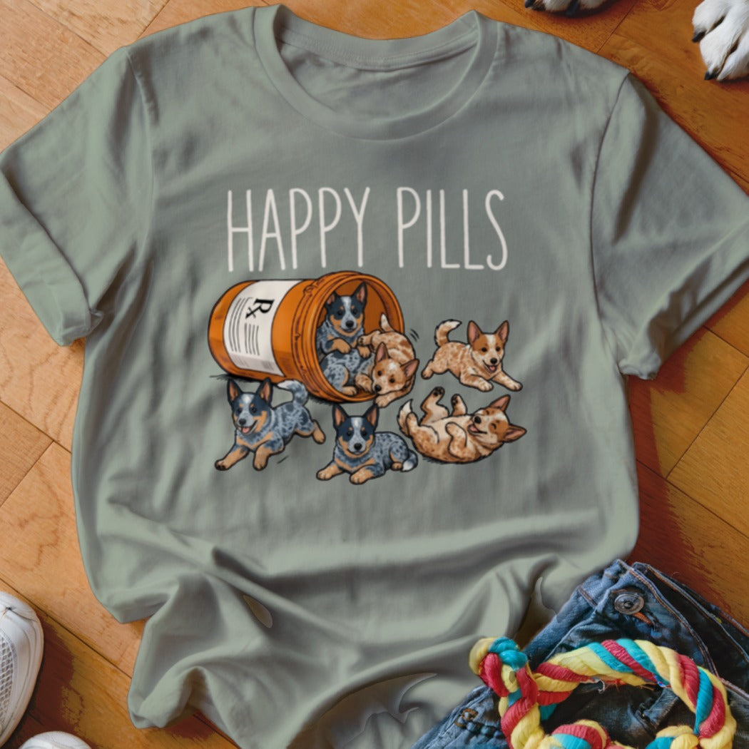 T-shirt graphic with "HAPPY PILLS" text and six puppies spilling from a pill bottle.