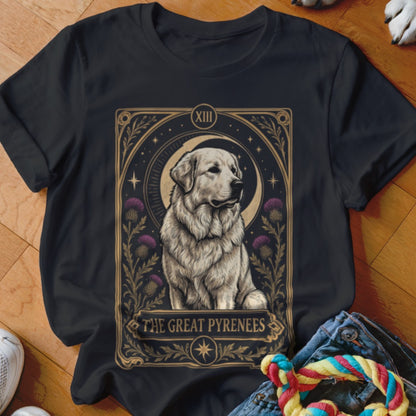 A black t-shirt features a tarot-style graphic of a Great Pyrenees dog with purple thistles and a crescent moon.