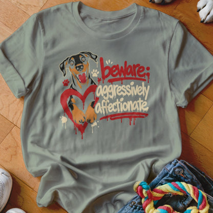 T-shirt with a dog illustration and text "beware; aggressively affectionate".