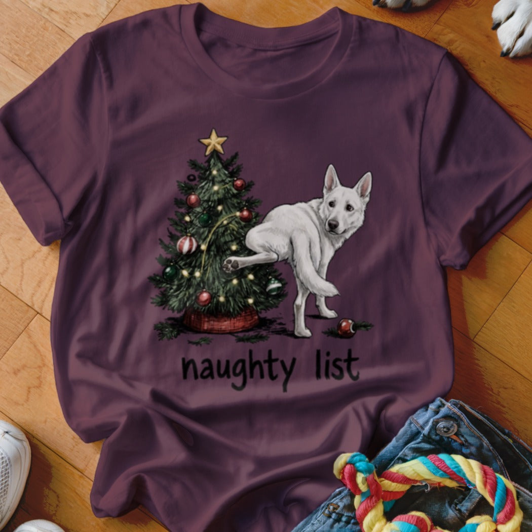 White German Shepherd standing by a Christmas tree with text "naughty list"