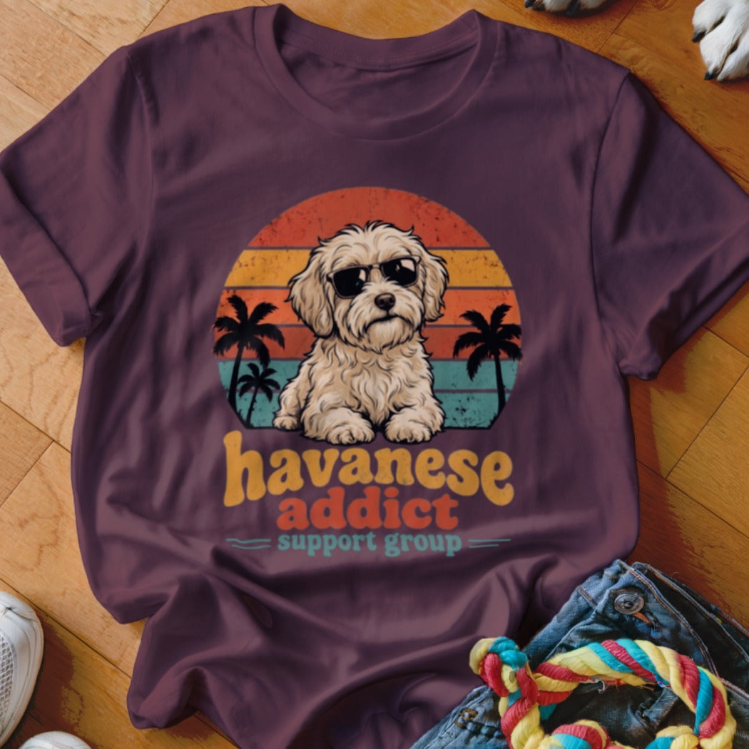 Maroon crewneck t-shirt featuring a retro sunset graphic with a Havanese dog in sunglasses, palm trees, and text reading Havanese addict support group.