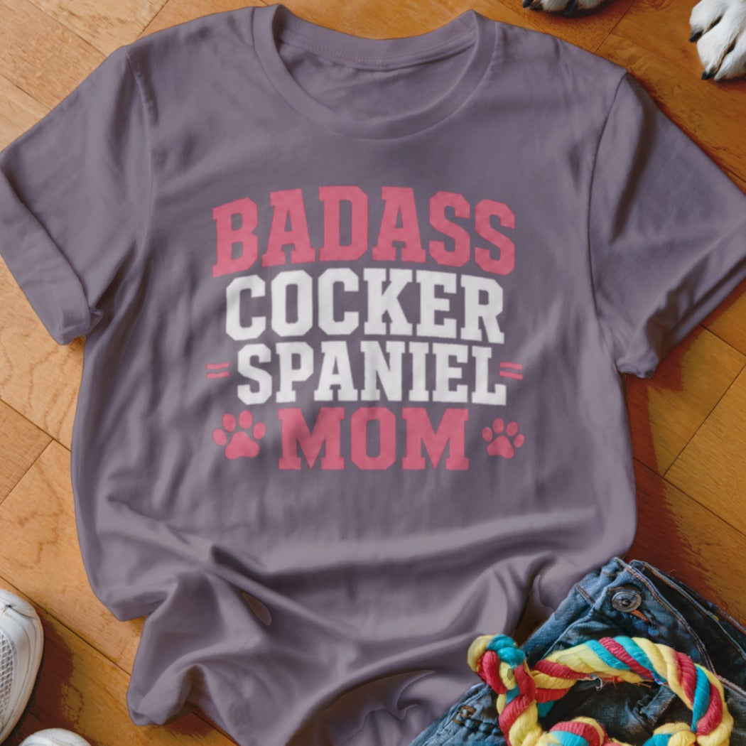 Gray t-shirt with pink and white text that reads "BADASS COCKER SPANIEL MOM."