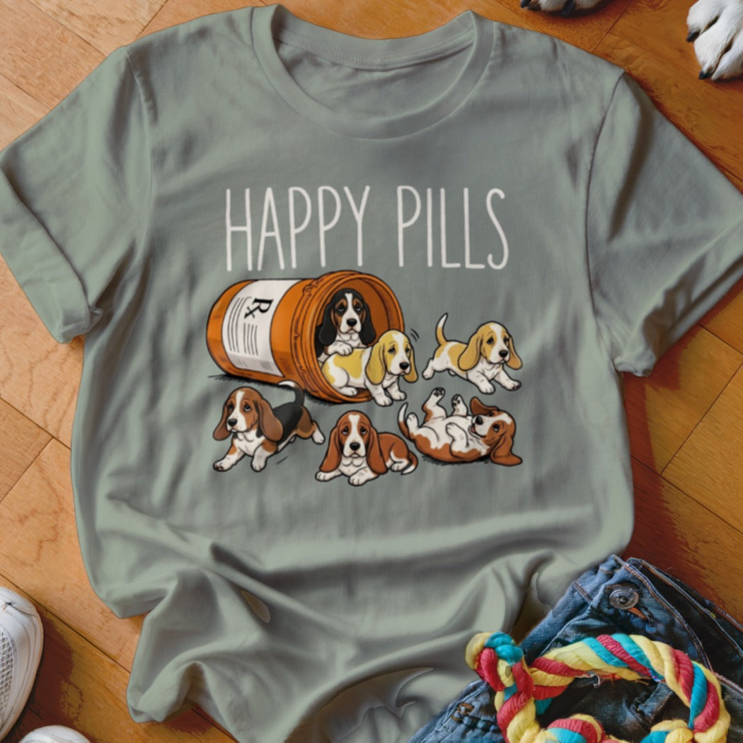 T-shirt with illustration of Basset Hound puppies spilling from a pill bottle, with "HAPPY PILLS" text.