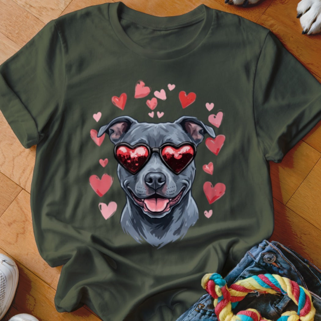 Dark green t-shirt featuring a graphic of a grey dog wearing heart-shaped sunglasses surrounded by floating pink hearts.