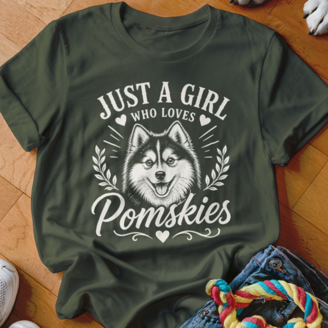 Dark green t-shirt with "Just a girl who loves Pomskies" text and dog graphic.