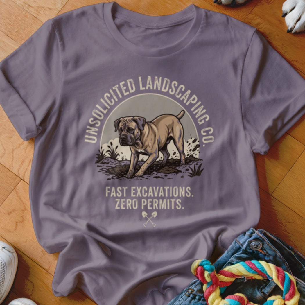 T-shirt with graphic of dog digging, "UNSOLICITED LANDSCAPING CO." and "FAST EXCAVATIONS. ZERO PERMITS."