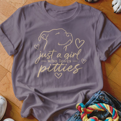 Purple t-shirt with outline of dog and text "just a girl who loves pitties".