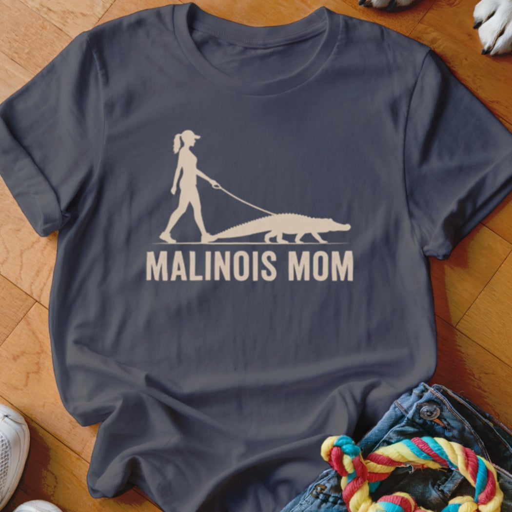 White graphic of woman walking a Malinois dog on leash, with "MALINOIS MOM" text.