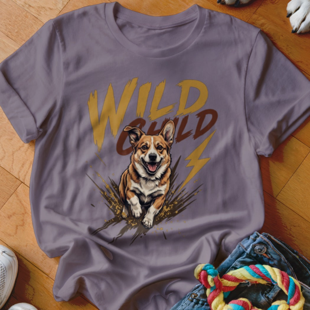 A grey short-sleeved t-shirt features a graphic of a corgi running through mud with the text Wild Child.