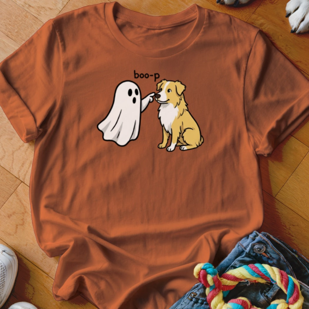 Orange t-shirt featuring a cartoon ghost booping a dog with the text "boo-p".