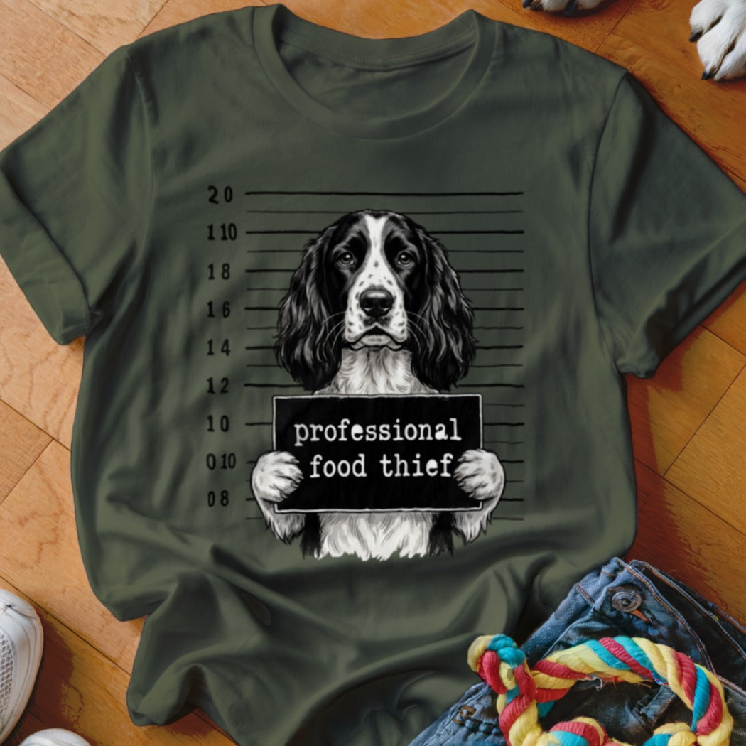 English Springer Spaniel mugshot with text "professional food thief" on a t-shirt.