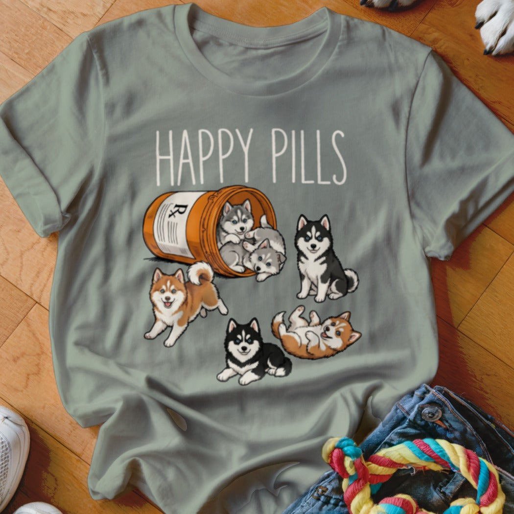 T-shirt with "HAPPY PILLS" text and several cartoon husky puppies spilling from a pill bottle.