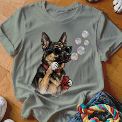 Sage green t-shirt featuring a graphic of a German Shepherd wearing sunglasses and blowing bubbles.