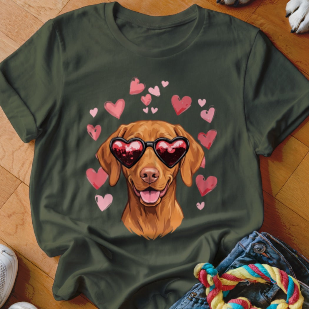 Dark green crewneck t-shirt featuring a brown dog wearing heart-shaped sunglasses surrounded by pink hearts.