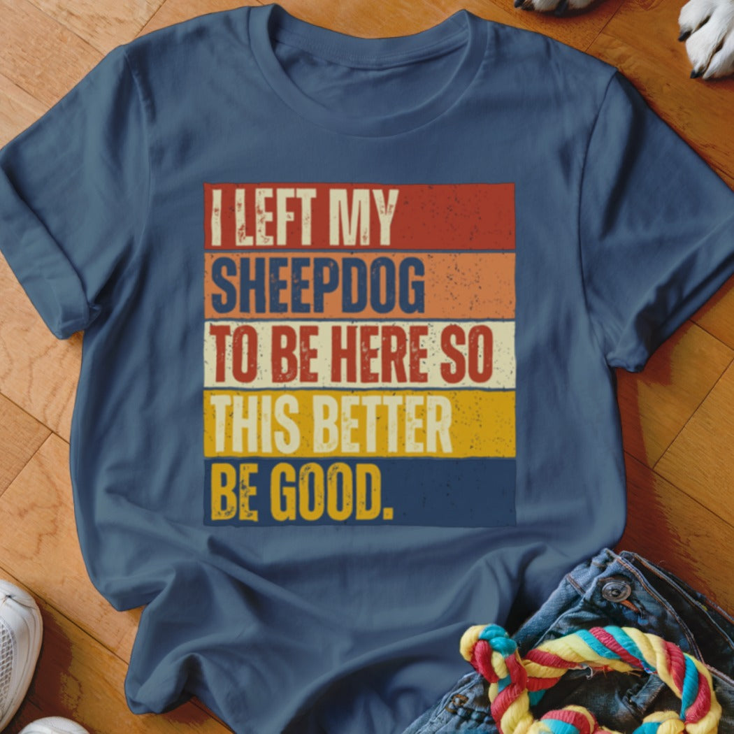 Navy t-shirt with retro stripes and text "I LEFT MY SHEEPDOG TO BE HERE SO THIS BETTER BE GOOD."