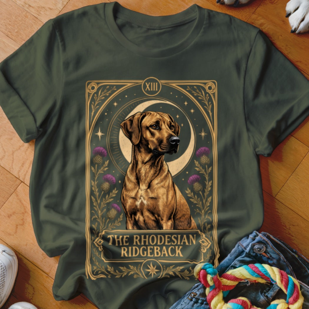 Dark green t-shirt featuring a tarot-style illustration of a Rhodesian Ridgeback dog with thistles and a crescent moon.