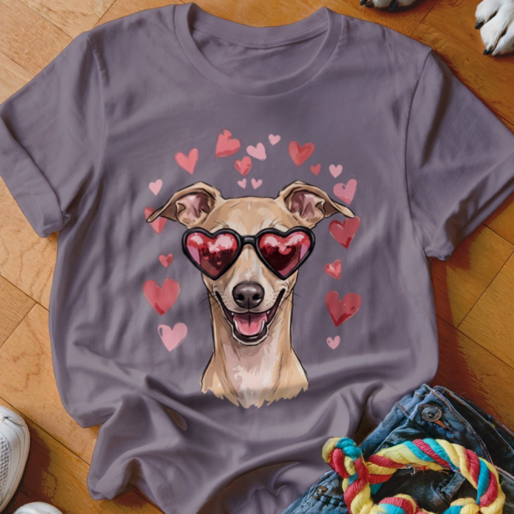 Grey t-shirt featuring an illustration of a fawn-colored dog wearing heart-shaped sunglasses surrounded by floating pink hearts.
