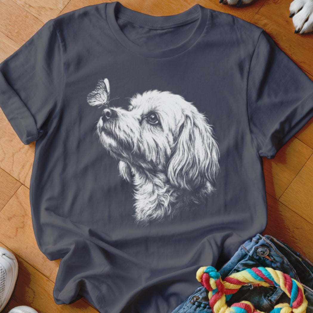 Dark gray crewneck t-shirt featuring a white sketch of a fluffy dog looking at a butterfly.