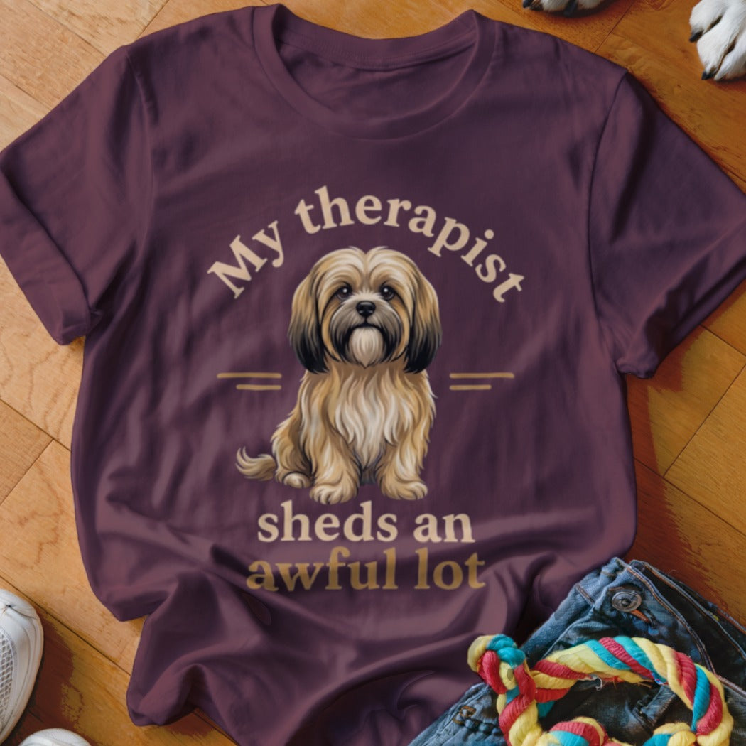 Maroon t-shirt with a shaggy dog illustration and text "My therapist sheds an awful lot".