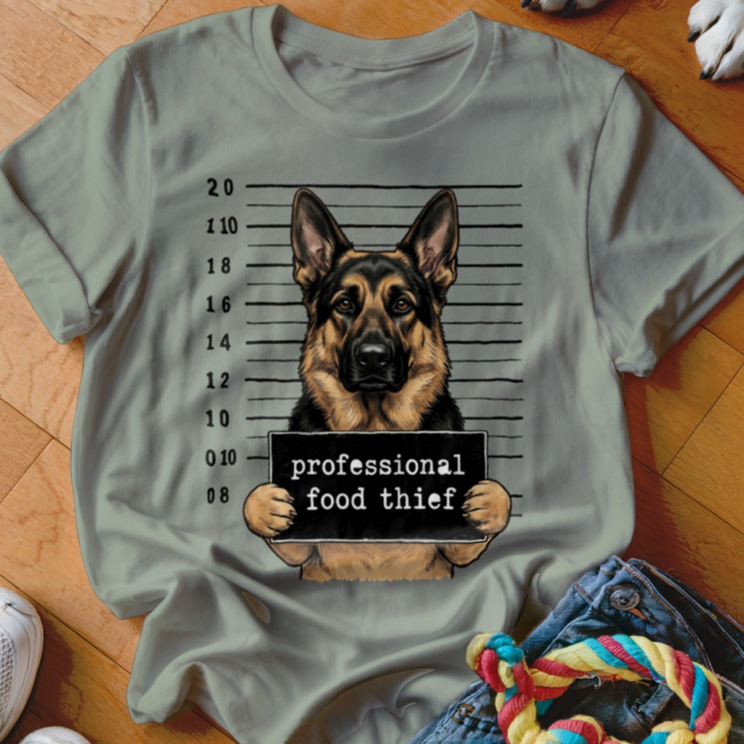 German Shepherd mugshot with sign reading "professional food thief."